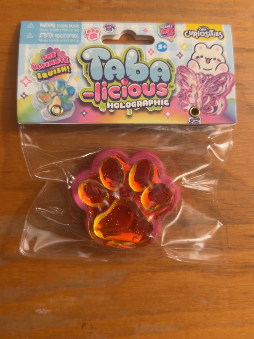 Taba-licious Holographic paw Squishy Pop Toy - Pink/Purple Iridescent